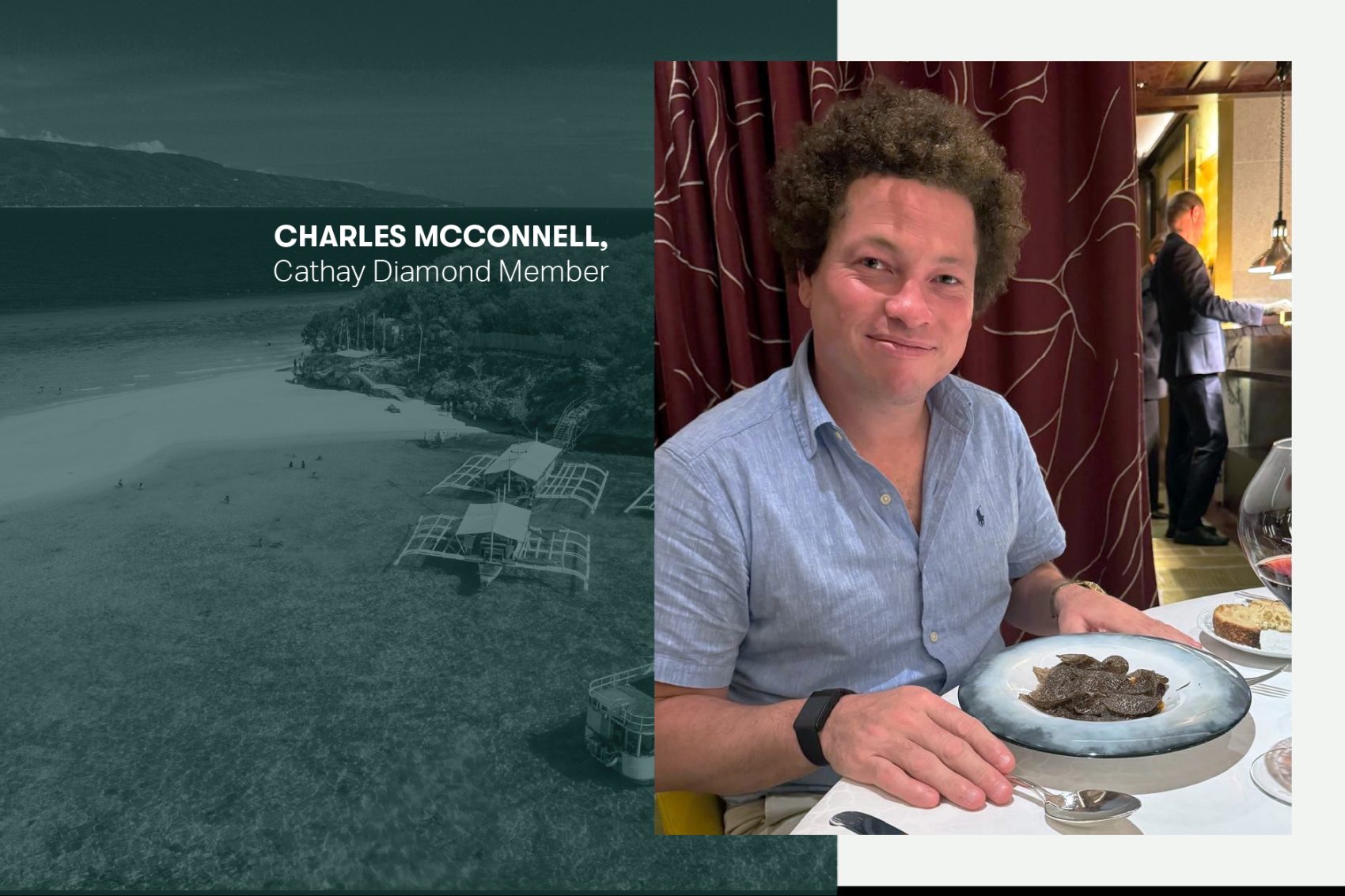 Charles McConnell smiling over a plate of food in a restaurant.
